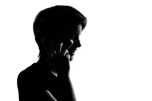 one caucasian young teenager silhouette boy or girl on the telephone  portrait in studio cut out isolated on white background