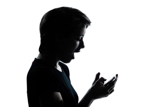 one caucasian young teenager silhouette girl telephone videophone video game  portrait in studio cut out isolated on white background