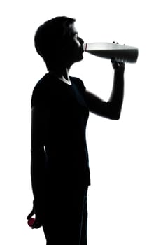 one caucasian young teenager silhouette boy or girl drinking milk  portrait in studio cut out isolated on white background