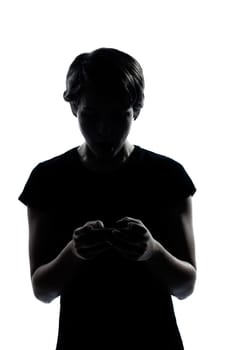 one caucasian young teenager silhouette boy or girl telephone videophone video game  portrait in studio cut out isolated on white background