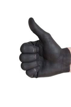 a black painted hand showing thumbs up gesture, isolated