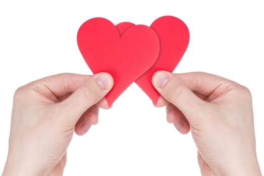Love concept. Hands holding two red paper  hearts .