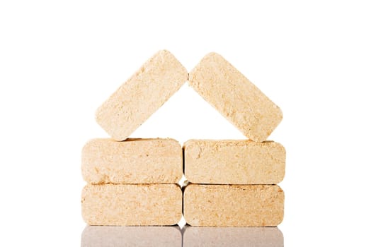 Wood sawdust briquettes , isolated on white