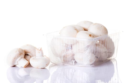 Edible button mushroom, 	champignon, isolated on white background