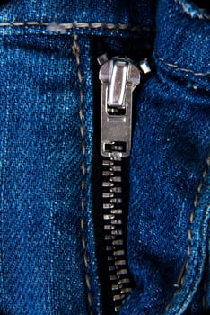 Blue jeans zip close up for background