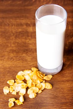 Glass of milk and corn flakes