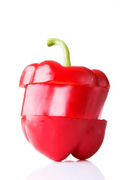 Sweet red sliced pepper isolated on white background
