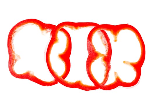 Sweet red sliced pepper isolated on white background