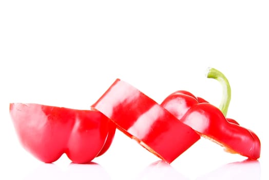 Sweet red sliced pepper isolated on white background
