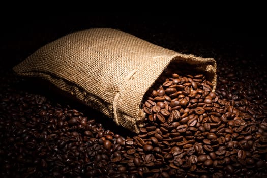 Fallen coffee sack in the middle of coffee beans