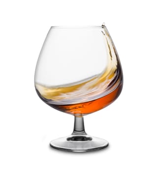 Cognac in motion in glass