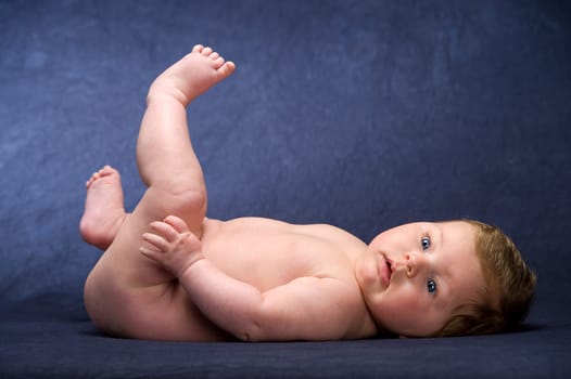 baby in front of blue background
