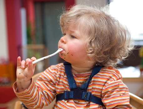 little child is eating