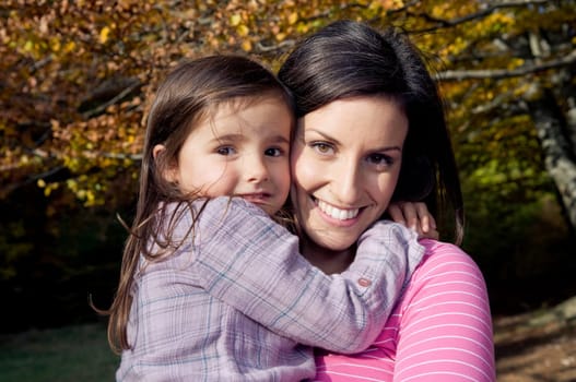 Mother and daughter outdoors on a autumn day