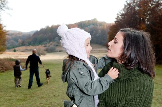 Family having a walk outdoors in autumn