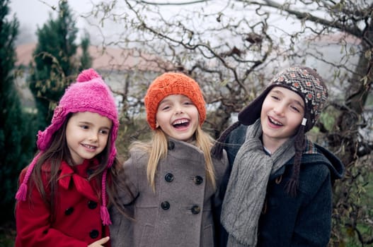 Happy kids outside in cold weather