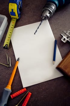 Tools and piece of blank paper