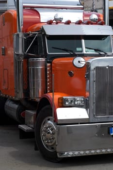Big orange transport truck on the street