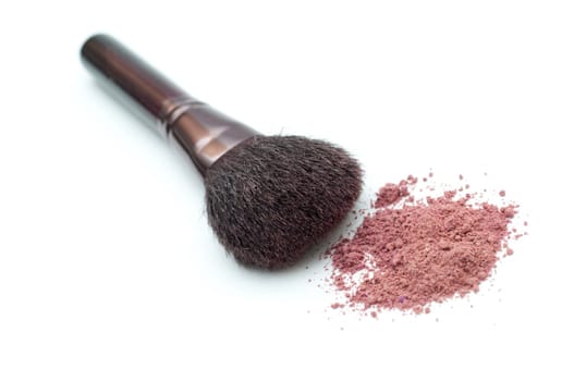 Makeup brush with powder isolated on white background