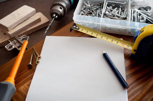 Piece of plank paper and working tools
