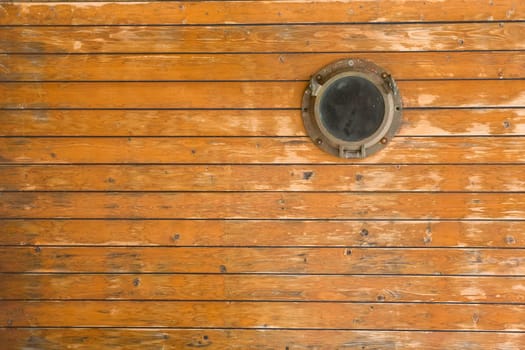 Old wooden ship porthole