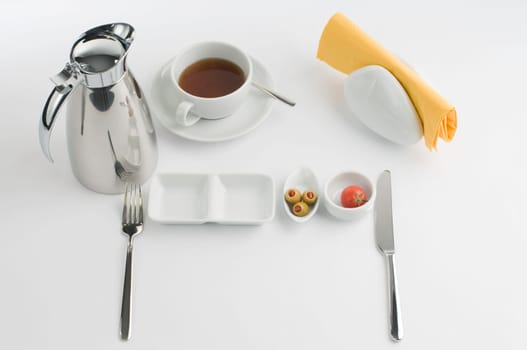 Breakfast table with thermos cup and white china