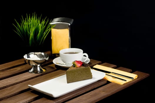 Coffee, cake, table set fork knife and flower
