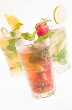 Mojito a Cuban cocktail made with cuban rum, lime, sugar , a splash of soda and flavoured with fresh fruit of your choice