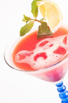 Tropical Fizz Champagne Cocktail made from cherry brandy, framboise, orange juice and topped up with Champagne