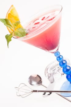 Tropical Fizz Champagne Cocktail made from cherry brandy, framboise, orange juice and topped up with Champagne