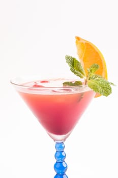 Tropical Fizz Champagne Cocktail made from cherry brandy, framboise, orange juice and topped up with Champagne