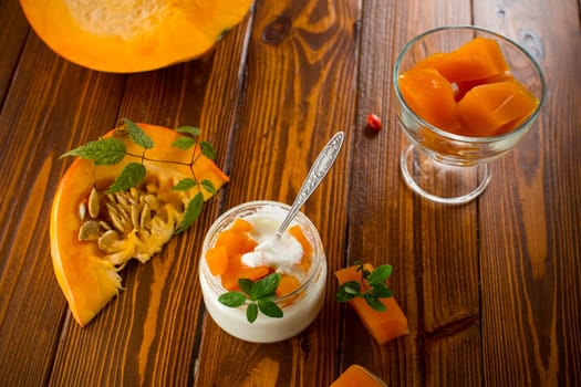 Homemade yogurt with pieces of pumpkin marmalade. Autumn recipes.