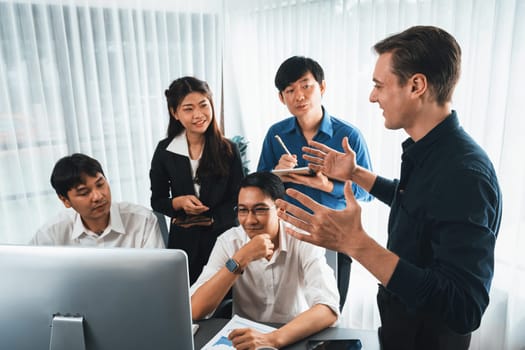 Group of diverse office worker employee working together on strategic business marketing planning in corporate office room. Positive teamwork in business workplace concept. Prudent