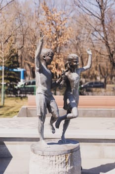 YEREVAN. ARMENIA. 29 MARCH 2022 : Bronze statue of a happy running children in the new Park dedicated to the 2800th anniversary of the Foundation of Yerevan.