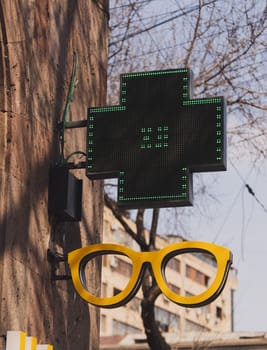 Sign in the shape of an eyeglasses frame. Spectacles store.