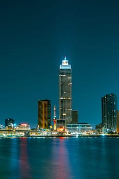 Spectacular Night View of Rotterdam from the Sea: Experience the Beauty of the City at Night.