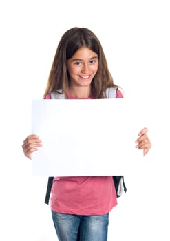 Schoolgirl with backpack holding a white sheet of paper