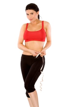 pretty brunette wearing sport outfit on white background