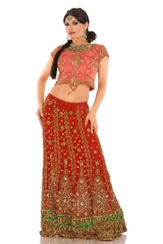 beautiful indian woman wearing bridal outfit on white