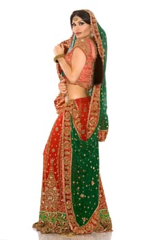 beautiful indian woman wearing bridal outfit on white