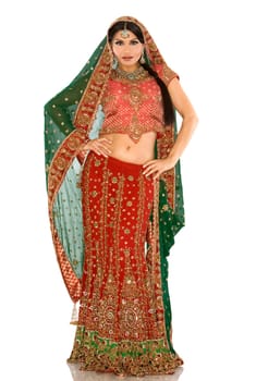 beautiful indian woman wearing bridal outfit on white