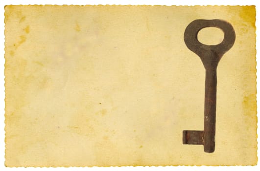 Old metal key on vintage paper background