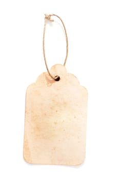 Cardboard price tag or sales label with string on white background