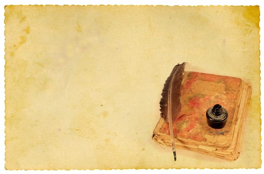 Quill, ink and old book on vintage paper