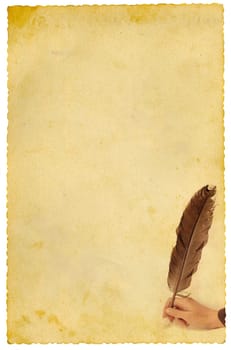 Hand writing with feather on old yellow paper. Isolated on white.
