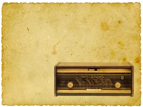 Vintage radio on old paper background. Isolated on white.
