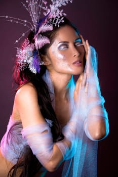 pretty brunette woman wearing white and silver accessories