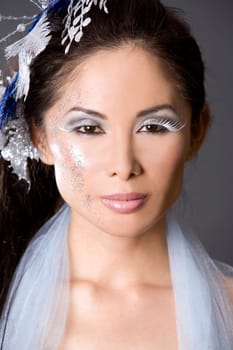 pretty brunette woman wearing white and silver accessories