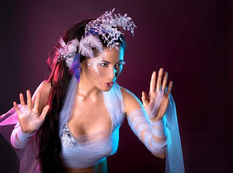 pretty brunette woman wearing white and silver accessories