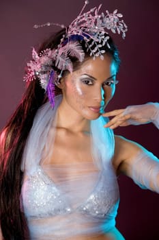 pretty brunette woman wearing white and silver accessories